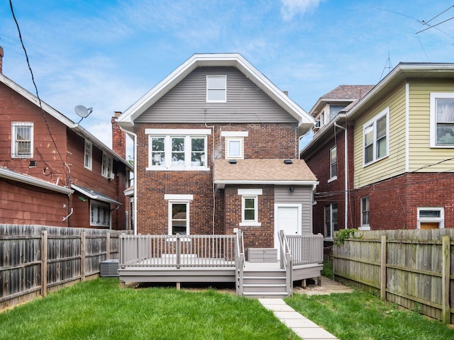 935 S Ohio Ave, Columbus, OH 43206 - rear view of house with a fenced backyard, brick siding, and a wooden deck