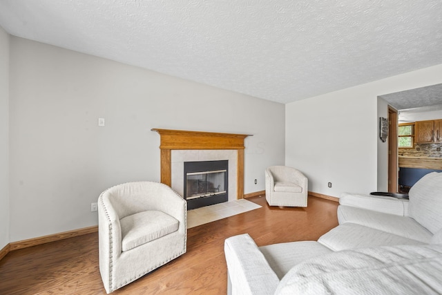 5528 Westerville Crossing Dr, Westerville, OH 43081 - living area featuring wood finished floors, a fireplace, and a textured ceiling