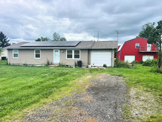 4345 Lancaster Kirkersville Rd NW, Lancaster, OH 43130 - view of front of house featuring solar panels, a front yard, and a shingled roof