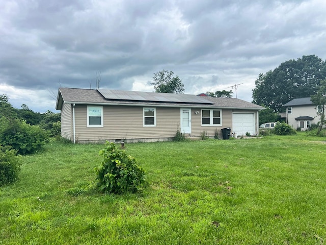 4345 Lancaster Kirkersville Rd NW, Lancaster, OH 43130 - view of front of house featuring solar panels, an attached garage, and a front lawn
