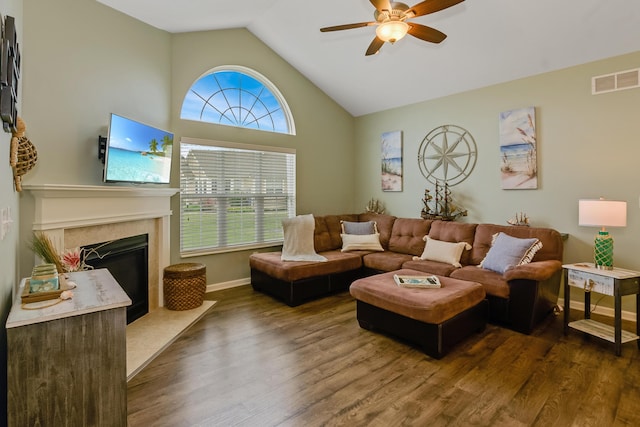 3242 Rossmore Cir, Powell, OH 43065 - living area featuring a ceiling fan, dark wood-style flooring, vaulted ceiling, and a fireplace