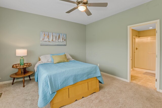 3242 Rossmore Cir, Powell, OH 43065 - carpeted bedroom featuring ensuite bath and a ceiling fan