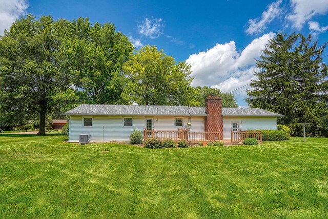 4979 Johnanne Dr, Groveport, OH 43125 - back of house with a lawn, a deck, and a chimney