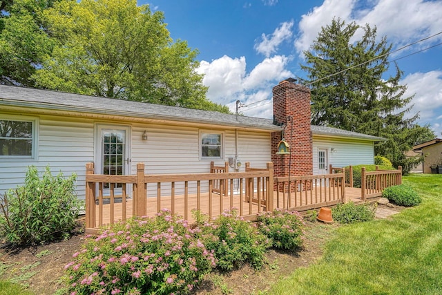 4979 Johnanne Dr, Groveport, OH 43125 - rear view of property featuring a deck, a chimney, and a yard
