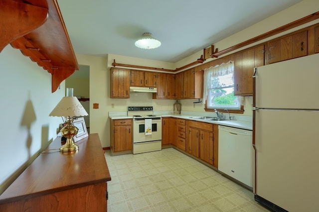 4979 Johnanne Dr, Groveport, OH 43125 - kitchen with white appliances, light floors, brown cabinets, and light countertops