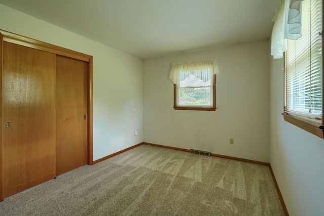 4979 Johnanne Dr, Groveport, OH 43125 - unfurnished bedroom featuring carpet flooring and a closet