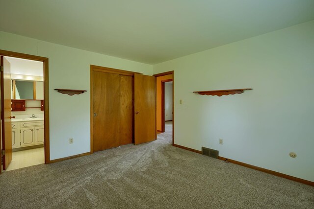 4979 Johnanne Dr, Groveport, OH 43125 - unfurnished bedroom featuring carpet flooring, a closet, and ensuite bathroom