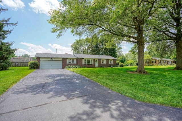 4979 Johnanne Dr, Groveport, OH 43125 - ranch-style home with driveway, an attached garage, and brick siding