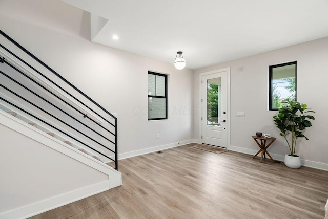 546 W Town St, Columbus, OH 43215 - entrance foyer with plenty of natural light, stairs, light wood-style flooring, and recessed lighting