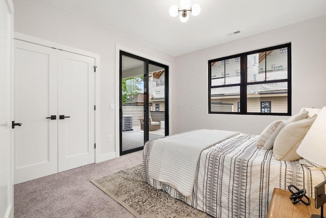 546 W Town St, Columbus, OH 43215 - carpeted bedroom featuring access to outside and baseboards