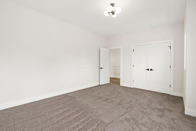 546 W Town St, Columbus, OH 43215 - unfurnished bedroom featuring carpet flooring and a closet