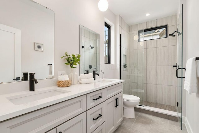 546 W Town St, Columbus, OH 43215 - full bath with double vanity, a shower stall, and tile patterned floors