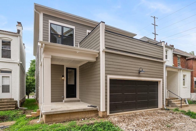 546 W Town St, Columbus, OH 43215 - view of front of home featuring a garage