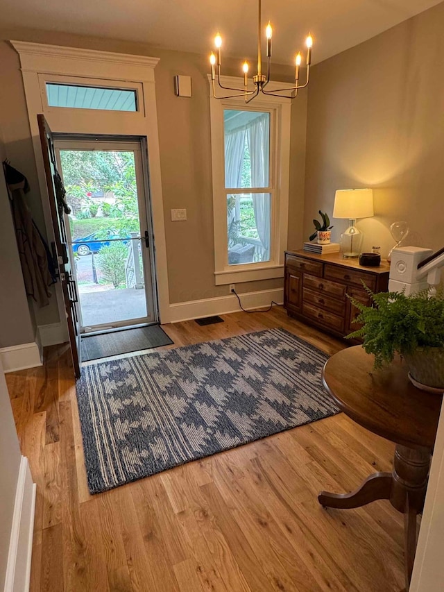 489 W 4th Ave, Columbus, OH 43201 - entrance foyer with a chandelier, wood finished floors, and plenty of natural light