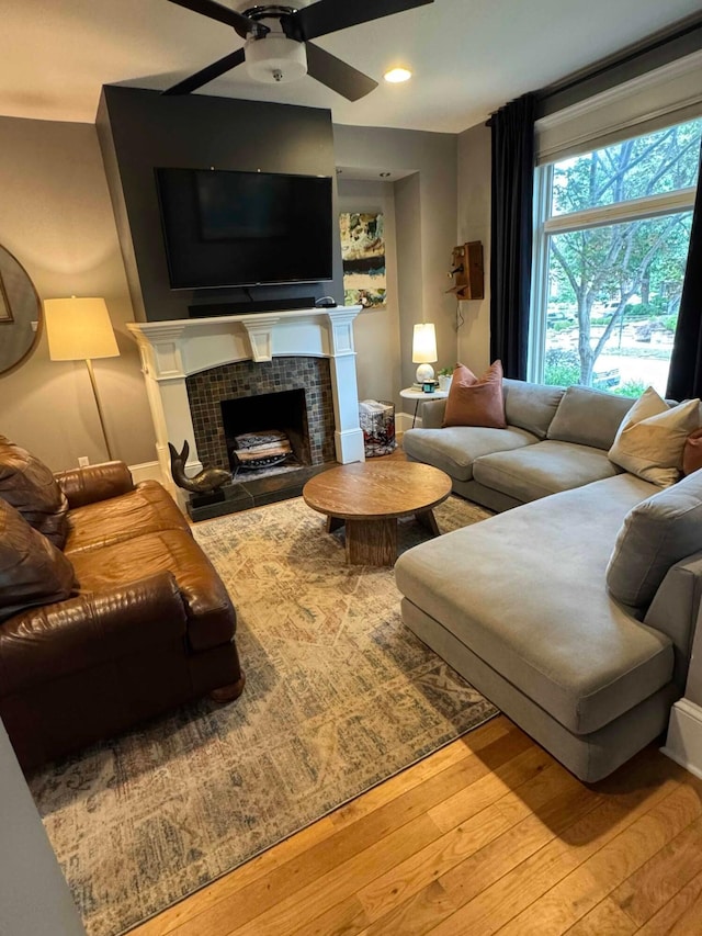 489 W 4th Ave, Columbus, OH 43201 - living area with a ceiling fan, wood finished floors, a tiled fireplace, and recessed lighting