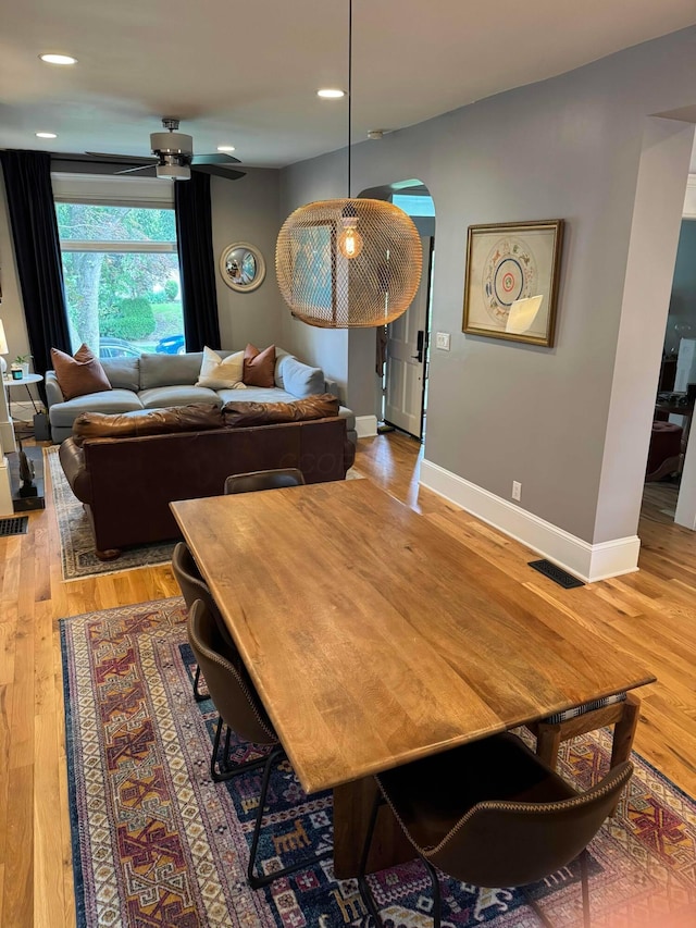 489 W 4th Ave, Columbus, OH 43201 - dining area featuring arched walkways, light wood-type flooring, a ceiling fan, and recessed lighting