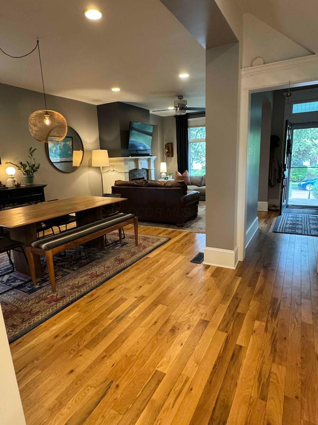 489 W 4th Ave, Columbus, OH 43201 - living area featuring wood-type flooring, recessed lighting, a ceiling fan, and a fireplace