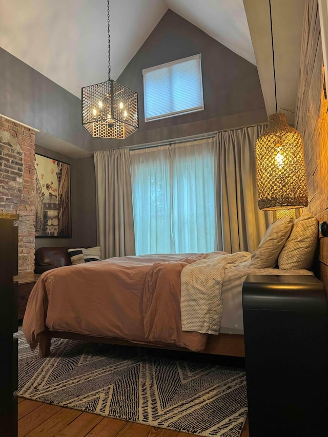 489 W 4th Ave, Columbus, OH 43201 - bedroom featuring high vaulted ceiling, a chandelier, and wood finished floors