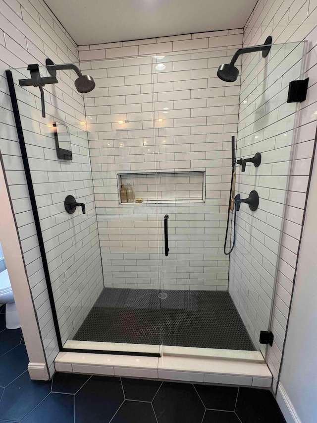 489 W 4th Ave, Columbus, OH 43201 - bathroom with tile patterned flooring and a stall shower