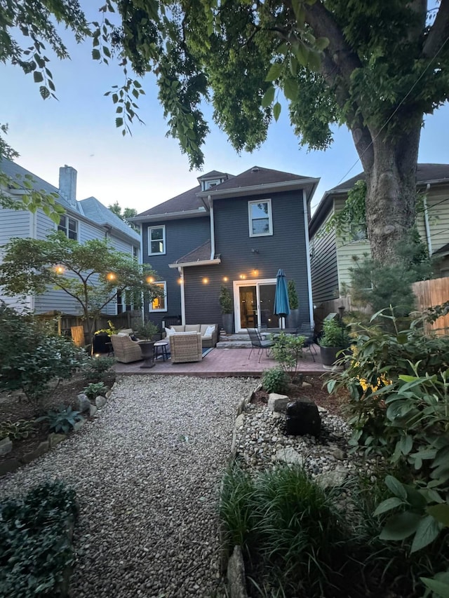 489 W 4th Ave, Columbus, OH 43201 - back of house at dusk featuring outdoor lounge area and a patio