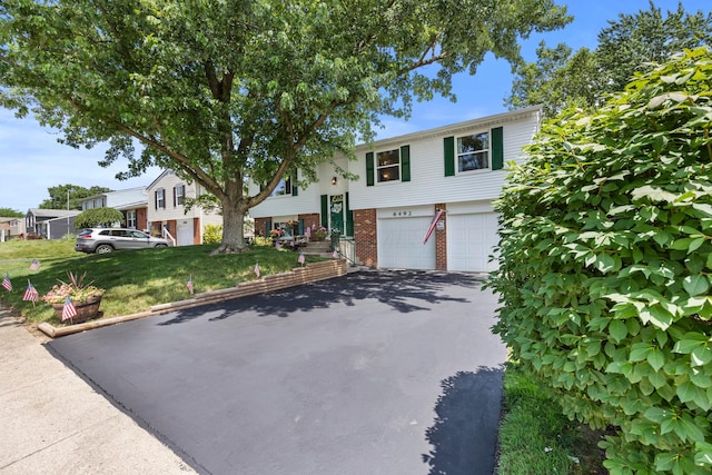 6492 Cherokee Rose Dr, Westerville, OH 43081 - view of front of property featuring driveway, a garage, and brick siding