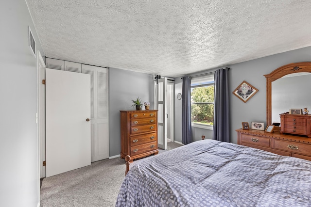 6492 Cherokee Rose Dr, Westerville, OH 43081 - carpeted bedroom with a textured ceiling and a closet
