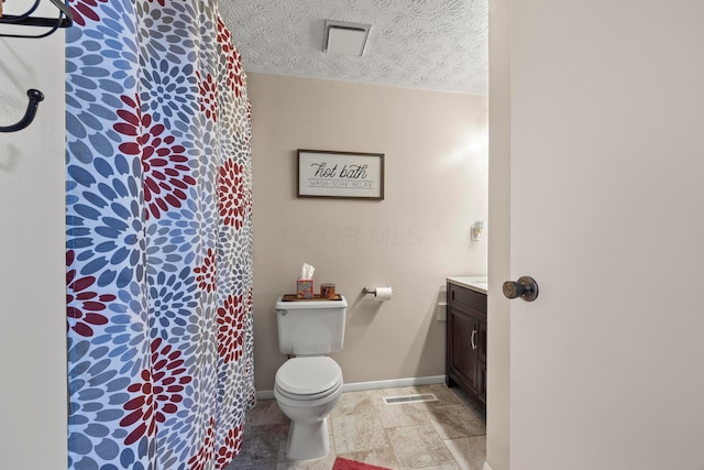 6492 Cherokee Rose Dr, Westerville, OH 43081 - full bathroom featuring vanity, a textured ceiling, and stone finish flooring