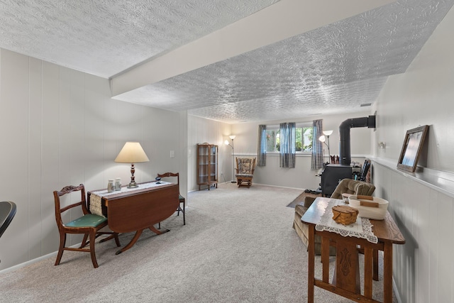 6492 Cherokee Rose Dr, Westerville, OH 43081 - carpeted living area featuring a wood stove and a textured ceiling