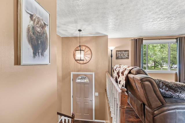 6492 Cherokee Rose Dr, Westerville, OH 43081 - foyer featuring a textured ceiling and a chandelier