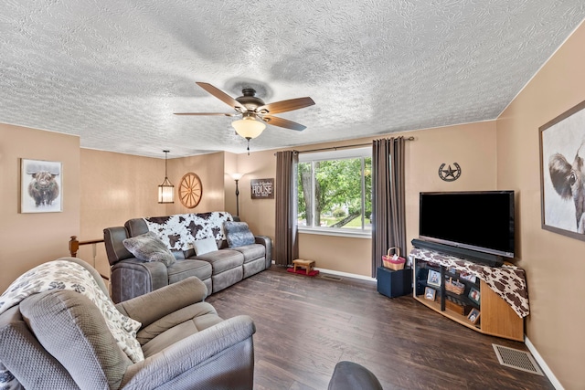 6492 Cherokee Rose Dr, Westerville, OH 43081 - living room featuring wood finished floors, ceiling fan, and a textured ceiling