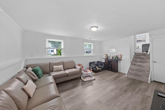 1310 Sweetbay Pl, Galloway, OH 43119 - living room with wood finished floors, stairs, and crown molding