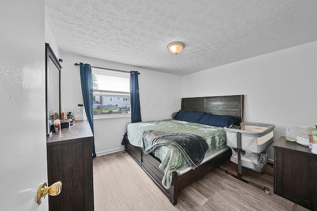 1310 Sweetbay Pl, Galloway, OH 43119 - bedroom with wood finished floors and a textured ceiling