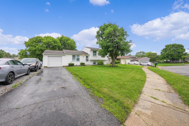 1310 Sweetbay Pl, Galloway, OH 43119 - tri-level home with an attached garage, a front yard, and driveway