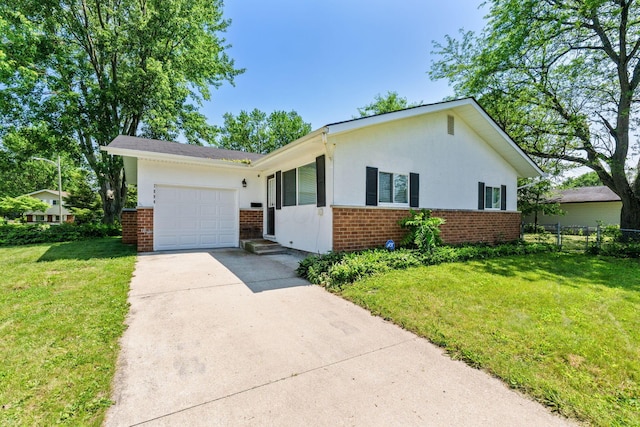1894 Orlando Rd, Columbus, OH 43232 - view of front facade featuring brick siding, a garage, driveway, and stucco siding
