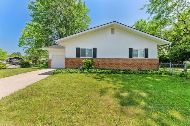 1894 Orlando Rd, Columbus, OH 43232 - view of side of property with brick siding, an attached garage, and concrete driveway