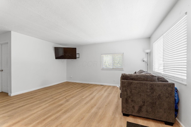 1894 Orlando Rd, Columbus, OH 43232 - living area featuring light wood-style flooring and a textured ceiling