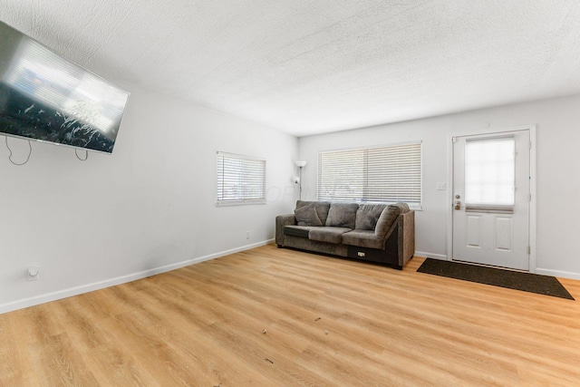 1894 Orlando Rd, Columbus, OH 43232 - living area featuring light wood-style flooring and a textured ceiling
