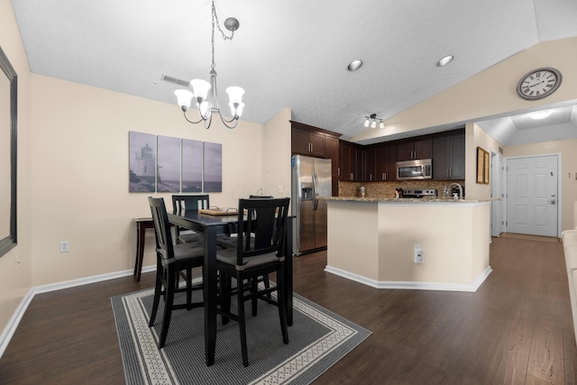 6150 Harbour Pointe Unit 201, Columbus, OH 43231 - dining area with lofted ceiling, a chandelier, dark wood-style flooring, and recessed lighting