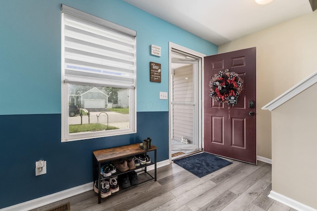 208 Dowler Dr, South Bloomfield, OH 43103 - foyer entrance featuring light wood-style flooring and baseboards