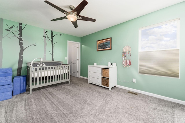 208 Dowler Dr, South Bloomfield, OH 43103 - bedroom featuring carpet floors, a crib, and a ceiling fan