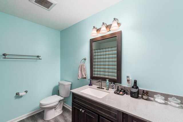 208 Dowler Dr, South Bloomfield, OH 43103 - bathroom featuring vanity and wood finished floors