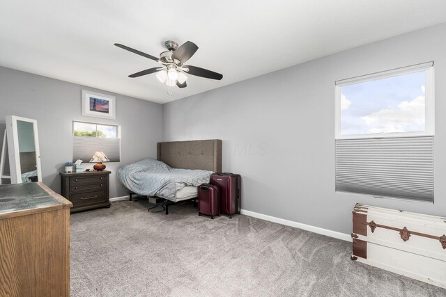 208 Dowler Dr, South Bloomfield, OH 43103 - carpeted bedroom with baseboards and a ceiling fan