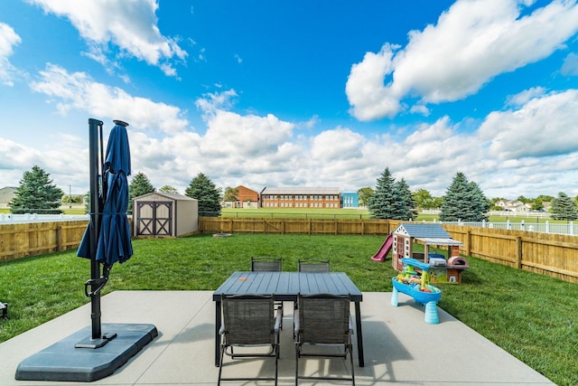 208 Dowler Dr, South Bloomfield, OH 43103 - fenced backyard with a patio area, a storage unit, and outdoor dining space