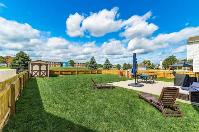 208 Dowler Dr, South Bloomfield, OH 43103 - fenced backyard featuring a patio and a storage unit