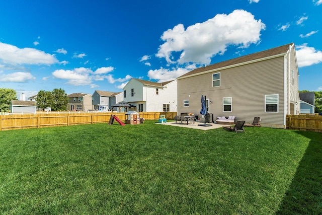 208 Dowler Dr, South Bloomfield, OH 43103 - back of house featuring a playground, a patio, a fenced backyard, and a residential view