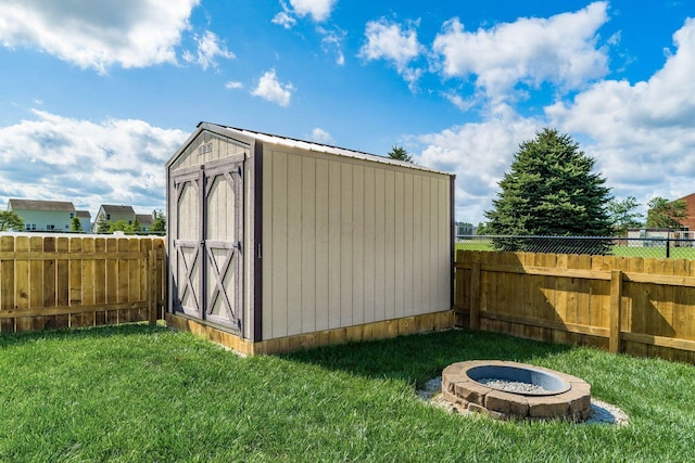 208 Dowler Dr, South Bloomfield, OH 43103 - view of shed with an outdoor fire pit and a fenced backyard
