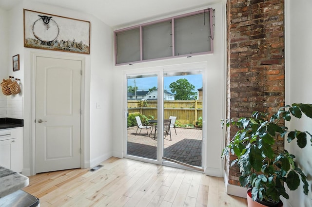 192 E Morrill Ave, Columbus, OH 43207 - doorway to outside featuring light wood finished floors