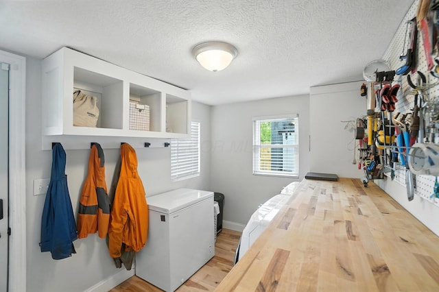 192 E Morrill Ave, Columbus, OH 43207 - laundry room with wood finished floors and a textured ceiling