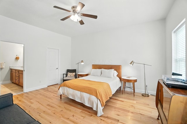 192 E Morrill Ave, Columbus, OH 43207 - bedroom featuring light wood finished floors, connected bathroom, and ceiling fan