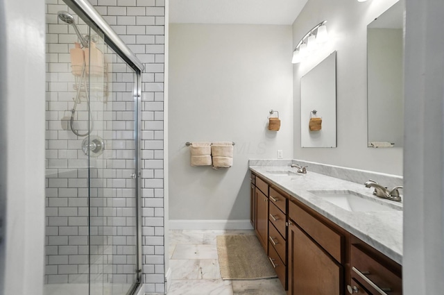 192 E Morrill Ave, Columbus, OH 43207 - bathroom with marble look tile flooring, a shower stall, and double vanity